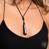Black Obsidian Talisman pendant necklace by Conscious Items featuring a protective black obsidian stone on a cord.