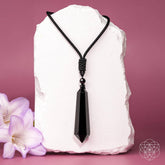 Black Obsidian Talisman pendant necklace from Conscious Items, featuring a protective black obsidian stone on a cord.