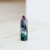Conscious Items The Cleansing Stone in point and pyramid shapes, made of natural stone for skincare and cleansing routines.