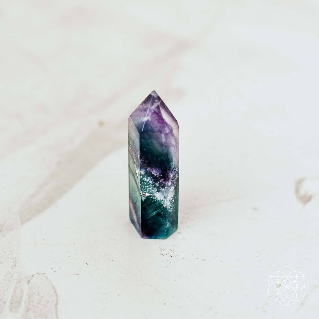 Conscious Items cleansing stone in point and pyramid shapes, made of natural stone, used for skincare or ritual cleansing.