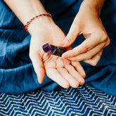 Conscious Items Cleansing Stone, Point & Pyramid shape, natural stone for skincare or spiritual cleansing, close-up view.
