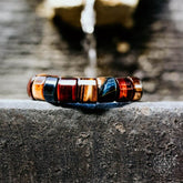 Conscious Items The Determination Bracelet featuring a sleek design with adjustable cord and metal charm for inspiring style.