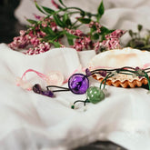 Close-up of The Emotional Healing Anklet by Conscious Items, featuring delicate chain and healing charm on a neutral background.
