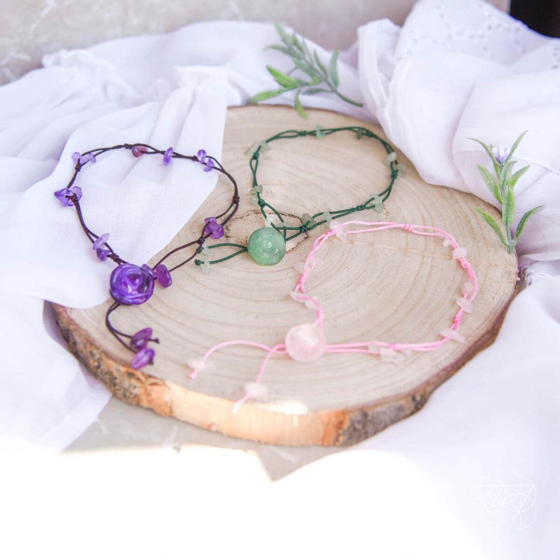 Silver anklet from Conscious Items featuring emotional healing charms, designed to promote positive energy and self-care.