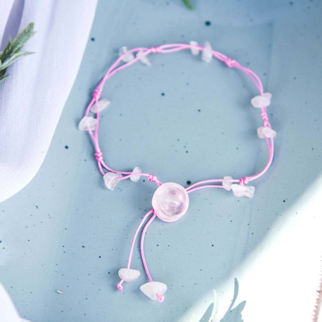 Silver anklet from Conscious Items featuring delicate charms for emotional healing and positive energy.