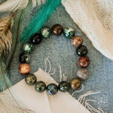 Close-up of a stylish Energy Bracelet by Conscious Items featuring beads and a sleek design, worn on a wrist.