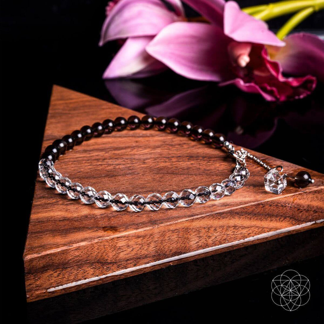Silver Energy Shield Anklet by Conscious Items featuring a delicate chain and charm, worn around the ankle.