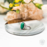 Close-up of the Heart-Healing Ring by Conscious Items, a silver ring with intricate heart-shaped design, on a neutral background.