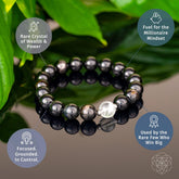 Hypersthene manifestation bracelet by Conscious Items featuring polished stone beads and a silver charm for positive energy and manifestation.