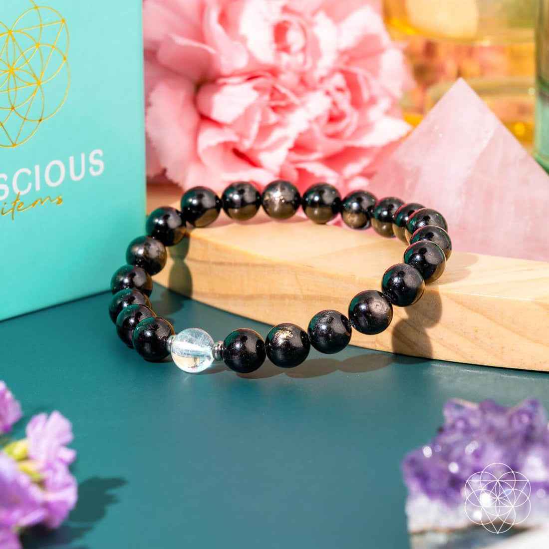 Hypersthene manifestation bracelet by Conscious Items featuring smooth black stones and silver accents for positive energy.
