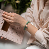 Conscious Items Law of Attraction bracelet featuring symbolic charms on a leather band, designed to promote positive energy.