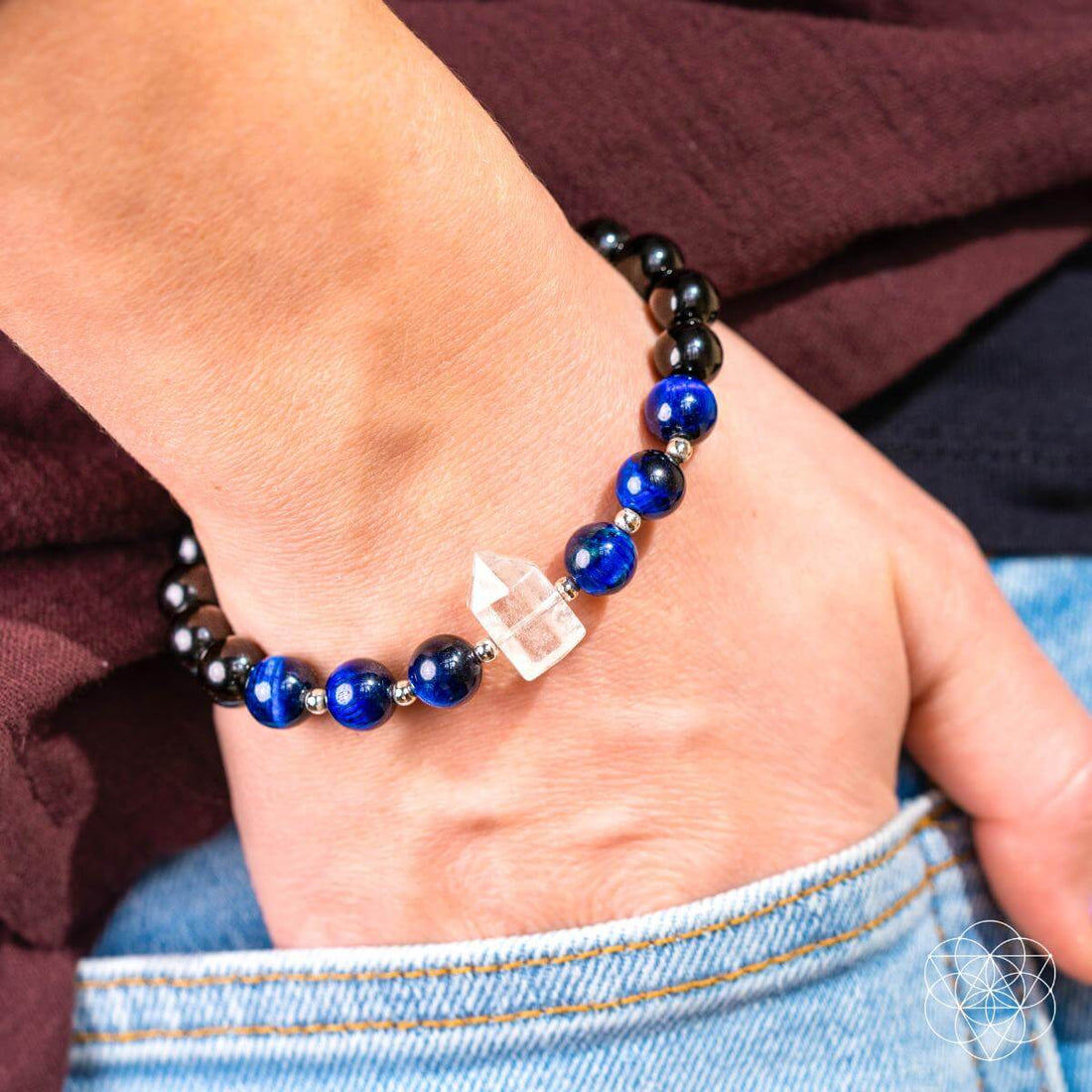 Conscious Items Negativity Filter Bracelet featuring a sleek design with symbolic charms for positive energy and emotional balance.