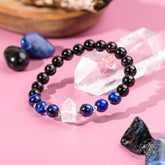 Conscious Items Negativity Filter Bracelet featuring black beads and a silver charm, designed to promote positive energy and mindfulness.