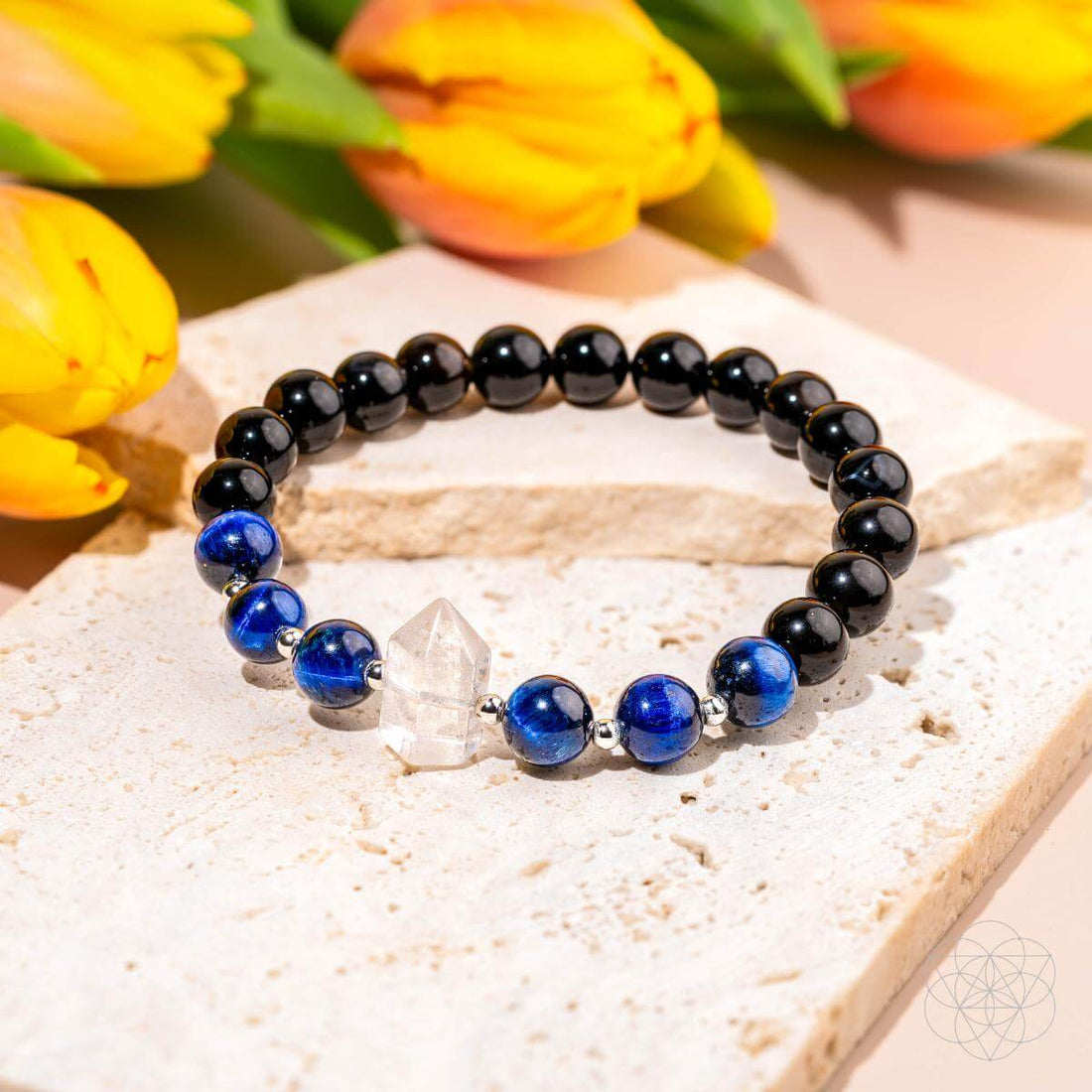 Close-up of The Negativity Filter Bracelet by Conscious Items, featuring a sleek design with positive energy symbols on a leather band.