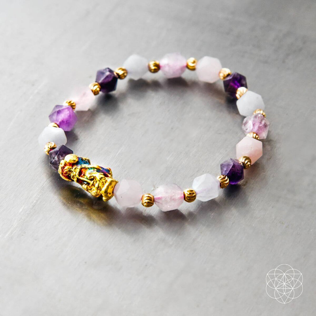 Close-up of The Prosperity Bracelet by Conscious Items, featuring beaded design with symbolic charms on a neutral background.