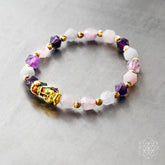 Close-up of The Prosperity Bracelet by Conscious Items, featuring beaded design with symbolic charms on a neutral background.