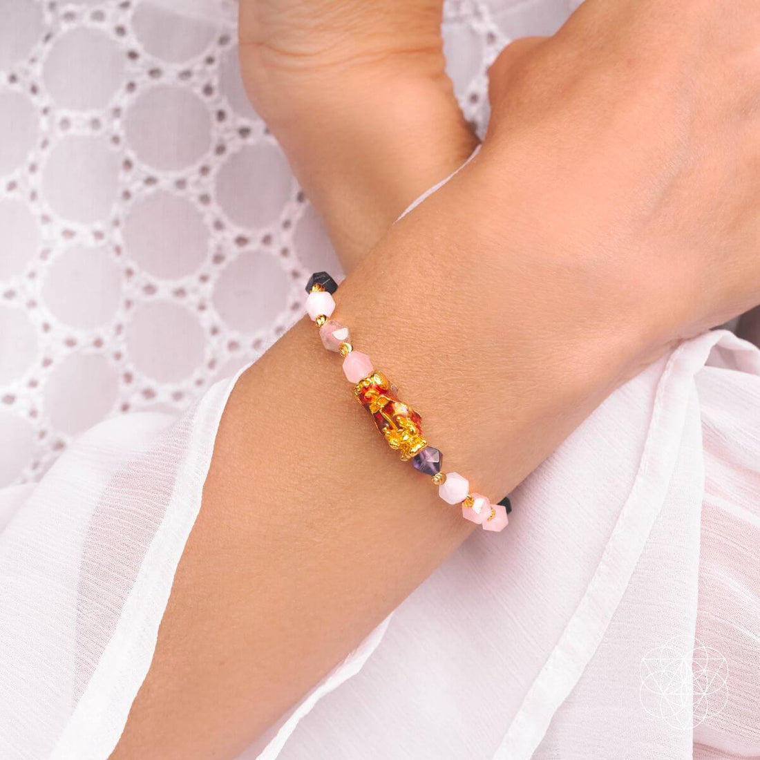 The Prosperity Bracelet by Conscious Items featuring a stylish beaded design with natural stones and a charm accent.