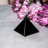 Decorative set of three pyramids made of natural stone for home decor by Conscious Items, featuring geometric shapes and earthy tones.