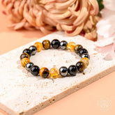Conscious Items quadruple protection bracelet featuring multiple strands and intricate bead design for stylish wristwear.