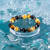 Conscious Items Quadruple Protection Bracelet featuring layered design with durable beads and charms, showcasing protective jewelry style.