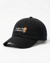 Black and orange Real Dads basketball cap with curved brim and embroidered logo, stylish and sporty headwear for men.