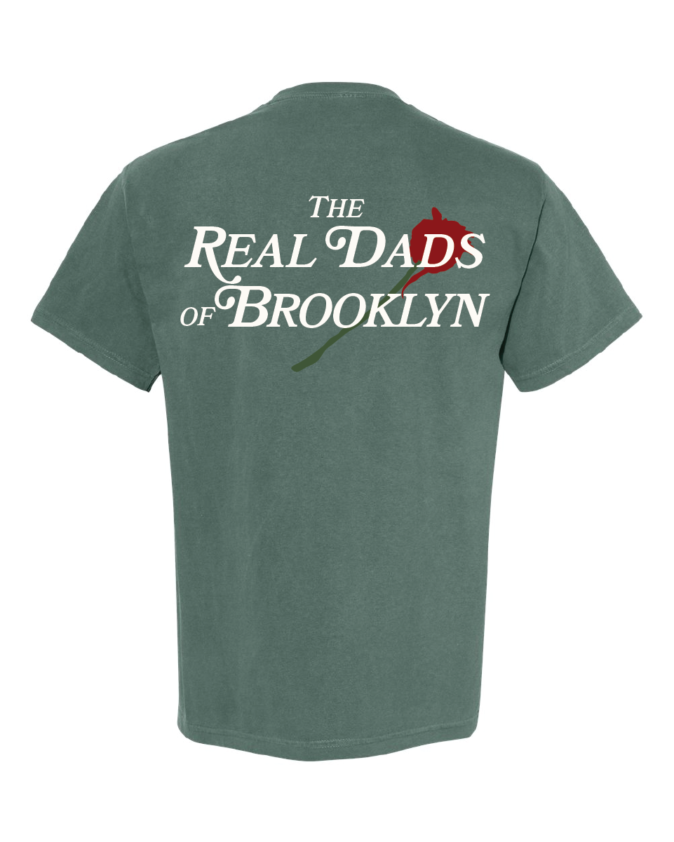 Faded green RDOB T-shirt by The Real Dads, featuring a relaxed fit and casual style on a plain background.