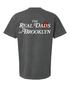 Faded grey RDOB T-shirt by The Real Dads, featuring a casual fit and soft cotton fabric, displayed on a hanger.