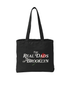 Black RDOB Tote bag by The Real Dads, showing a spacious fabric tote with sturdy handles and minimalist design.