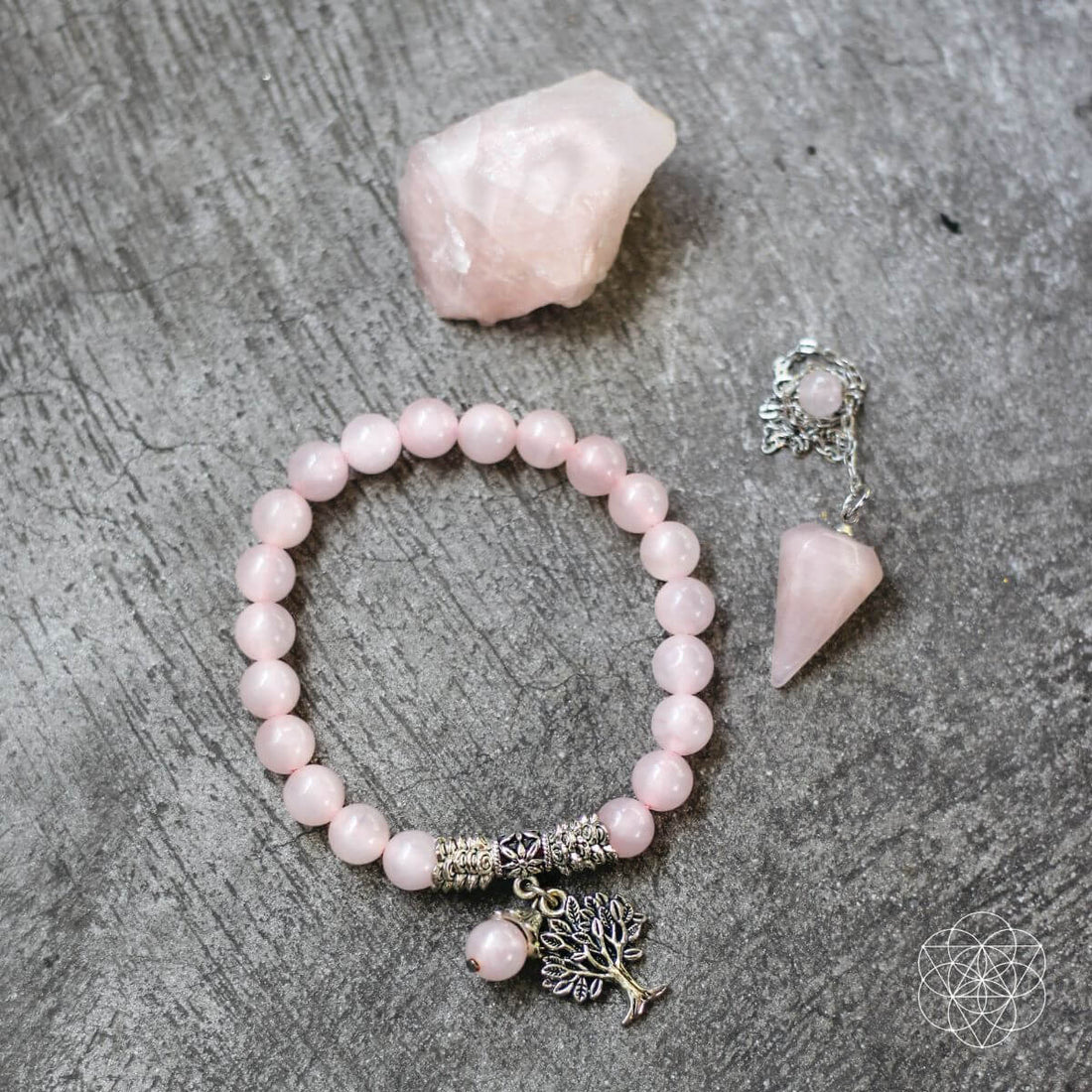 Rose quartz healing crystal jewelry set featuring bracelets and necklaces with polished pink stones from Conscious Items.