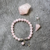 Rose quartz healing crystal jewelry set featuring bracelets and necklaces with polished pink stones from Conscious Items.