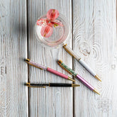 Self-cleaning crystal pens by Conscious Items, elegant home accessory with clear crystal design and sleek writing tips.