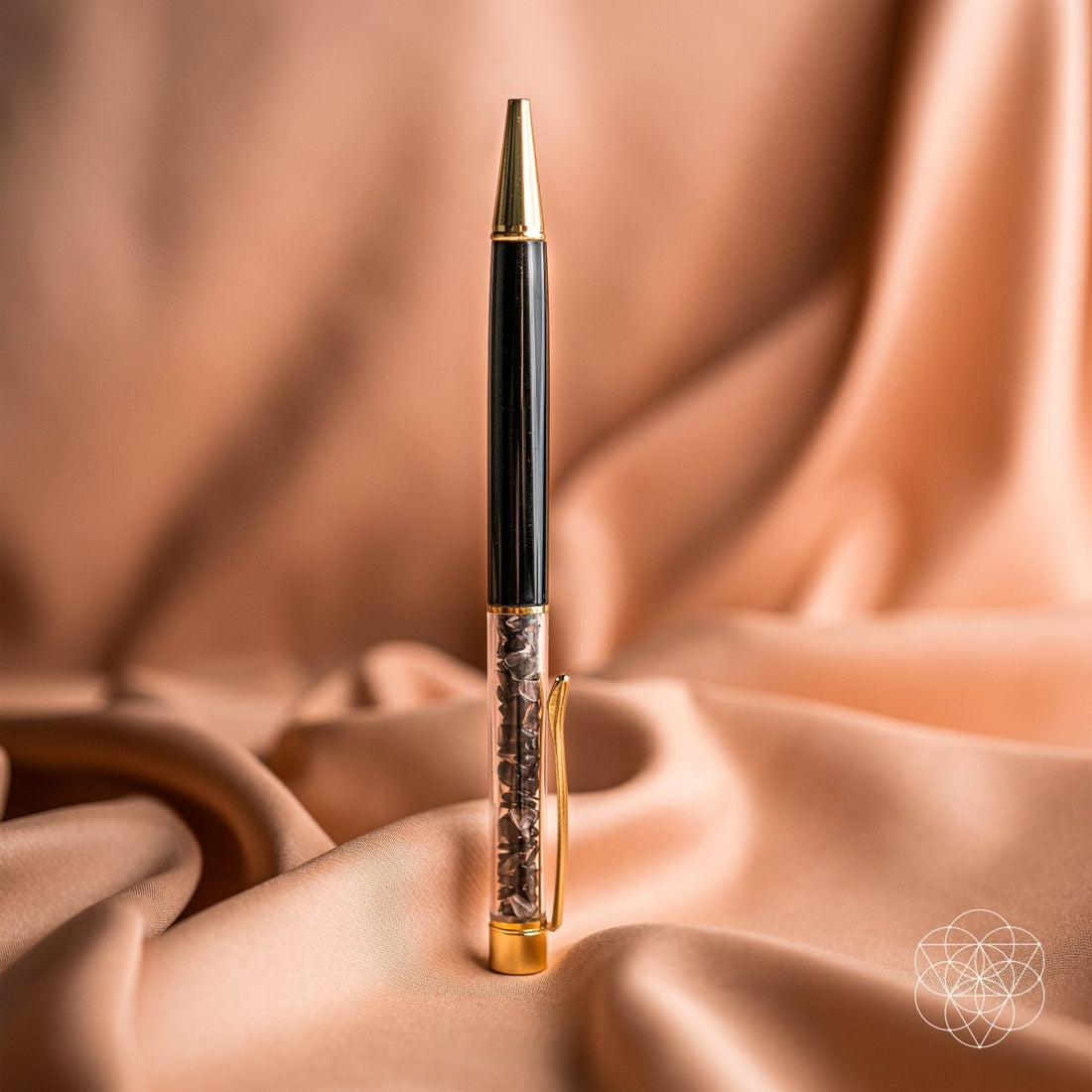 Self-cleaning crystal pens by Conscious Items, elegant home accessories with clear crystal bodies and sleek metal tips.