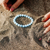 Close-up of The Soothing Bracelet by Conscious Items, featuring a sleek design with smooth beads and calming colors.