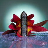 Rare Arfvedsonite point home decoration by Conscious Items, showcasing a deep blue mineral crystal on a sleek black base.