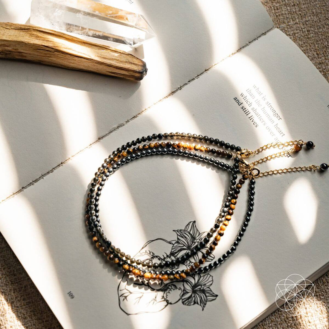 Triple Protection Anklet Set by Conscious Items featuring three layered anklets with delicate chains and adjustable clasps.