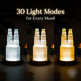 Two-tower Selenite lamp by Conscious Items, night light for energy cleansing and reset, with glowing white selenite crystals.