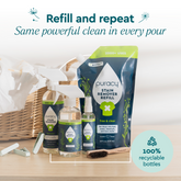Puracy laundry stain remover bottle with spray nozzle on a white background, showcasing the stain remover product.
