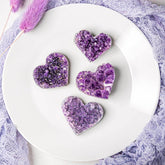 Uruguayan Amethyst Love Heart Cluster by Conscious Items showing raw purple amethyst crystals in a heart shape.
