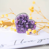 Uruguayan Amethyst Love Heart Cluster by Conscious Items showing raw, AAA premium quality purple amethyst crystals in a heart shape.
