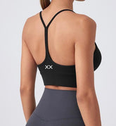 Blackout Barbell Milli Bra featuring soft fabric and adjustable straps, designed for comfortable wear and support.