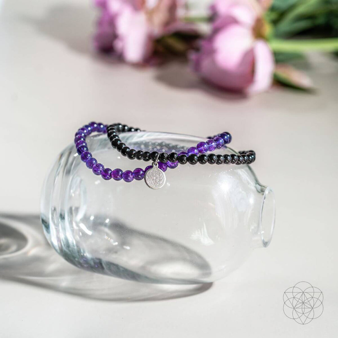 Jewelry set featuring the Veil of Protection - The Absolute Bracelet Set by Conscious Items, with multiple silver bracelets on a display.