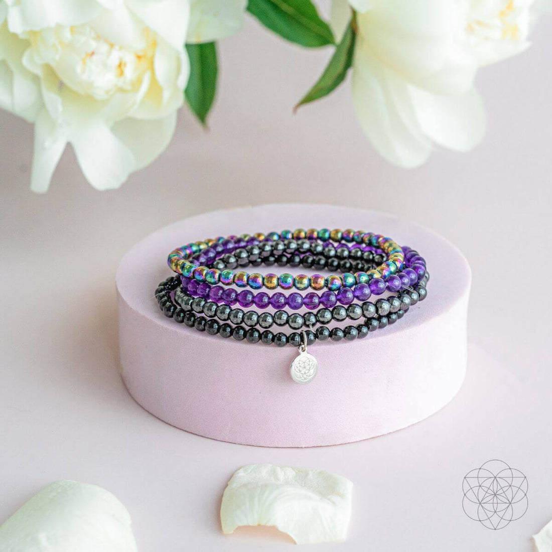 Bracelet set from the Veil of Protection collection by Conscious Items, featuring multiple jewelry pieces in a natural display.