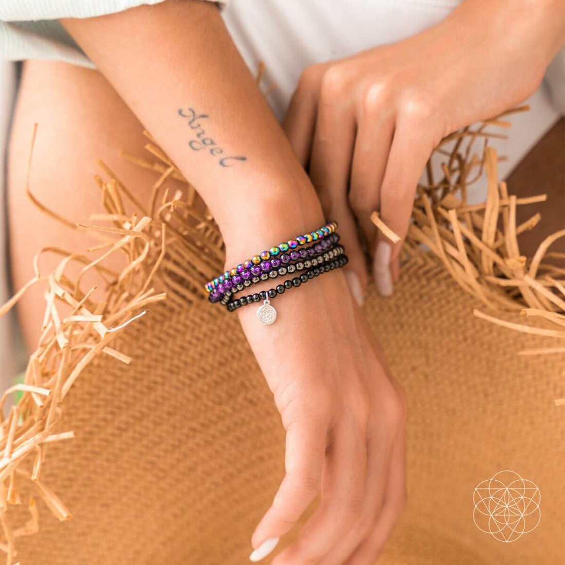 Jewelry set featuring the Veil of Protection - The Absolute Bracelet Set by Conscious Items, with multiple silver-toned bracelets.