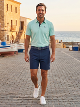 White Water Life Coastal Polo in aqua, featuring a casual fit with a collar and short sleeves, displayed on a plain background.