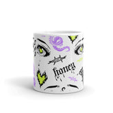 Yūjin Clothing honey-themed ceramic mug with a smooth handle, featuring a warm honey design on a white background.