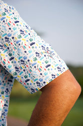 White Water Life Surfs Up Performance Polo in navy, featuring a collar, short sleeves, and surf-inspired graphic design.