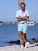 White Water Life Freeport Short Effortless Performance shorts in aqua, shown on a dockline background.