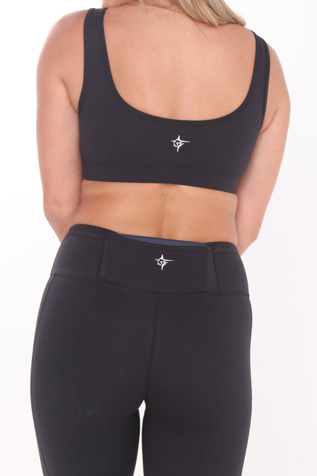 Black HydroFlex Cut Out Leggings by White Water Life, featuring stylish cut-out details and a sleek, form-fitting design.