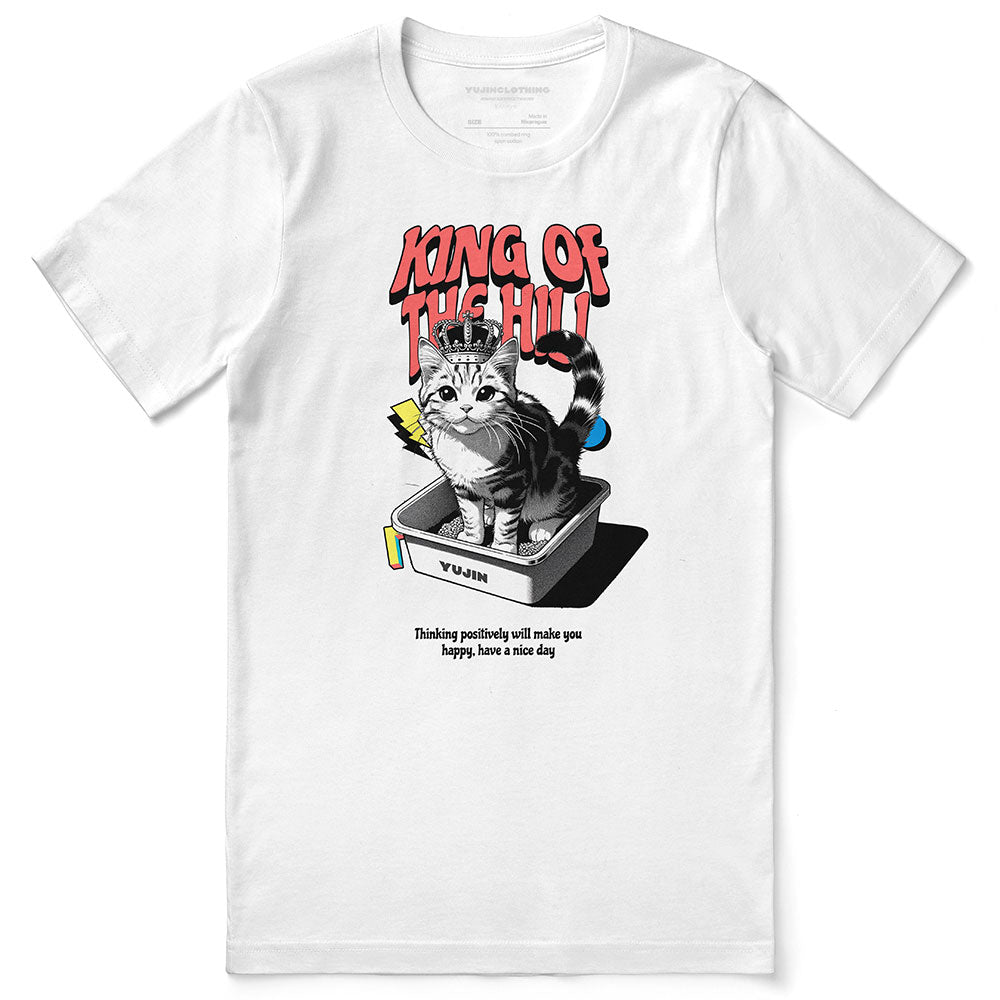 Yūjin Clothing King Of The Hill cat T-shirt featuring a graphic of a cat sitting atop a hill, casual and comfortable fit.