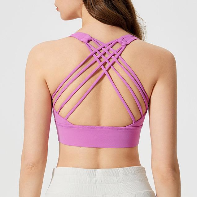 Blackout Barbell Ryla Bra shown on a model, featuring supportive design and adjustable straps for a comfortable fit.